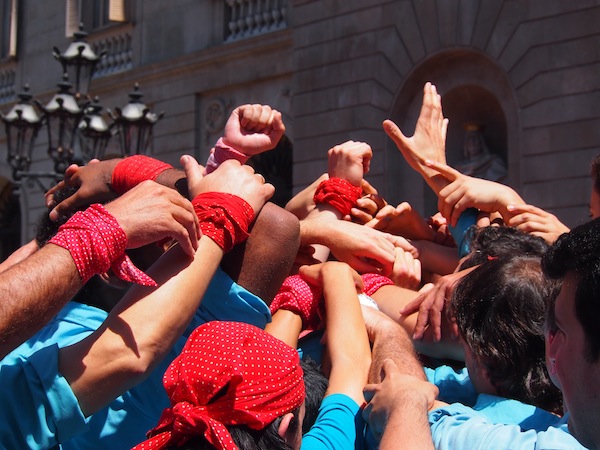 At the base, many arms are there to support the weight of the entire “human tower”!