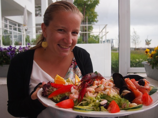My gourmet seafood salad tastes even better with a glass of wine overlooking the sea …