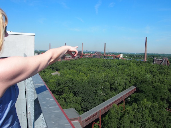 From the top of the building, Martina Tendick points out the former coking plants where, to this present day, coal is “coked” in large furnaces, albeit at a much lesser volume.