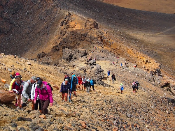 As we make our way towards the summit of the Tongariro Crossing at almost 2.000 metres above sea level …
