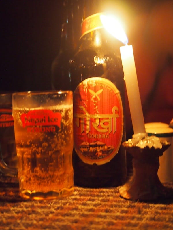 ... and Nepali "Gorkha" beer just to mark the occasion: Cheers with Rakesh and his friends by a lakeside bar in Pokhara!
