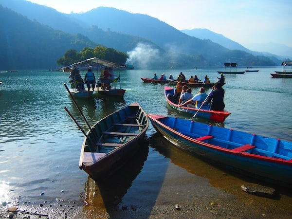 Heading out on Lake Phewa on the shores of the city of Pokhara, Nepal's second-largest ...