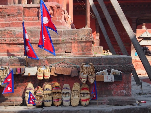 Nearing Durbar Square, some temples bid you to take your shoes off ... or buy some new ones, as exhibited here!