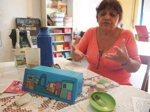 Cristina Mangravide, of the local cooperative "Los Pibes del Playón", has a heart for children and teenagers who she teaches all kinds of crafts and cooking in her local workshop run by volunteers in an attempt to get them away from the streets and crime.