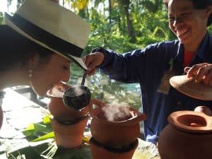 My friend Caroline Couret, who has joined me from the worldwide Creative Tourism Network organization, delights in local Thai tea ...