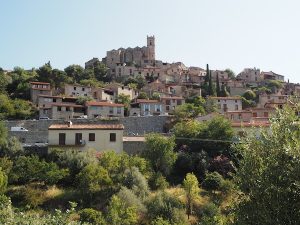The village of Eus sits high atop a hill, overlooking the surrounding landscape ...
