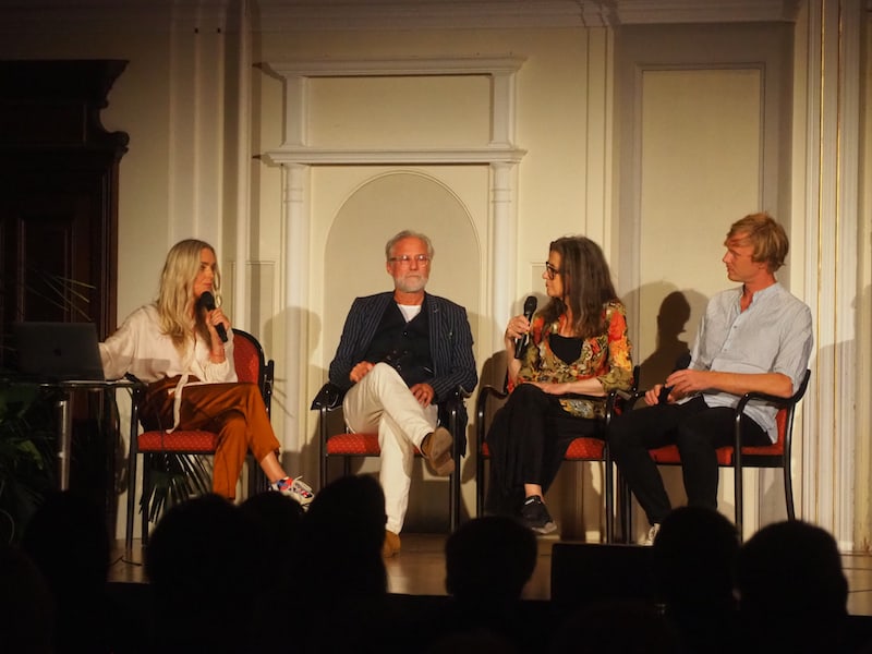 The young photographer is seated on the far right during the panel discussion at the Long Night of Photography.